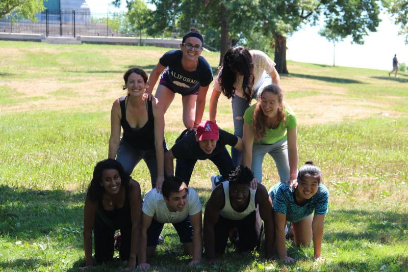 Researchers form a human pyramid at East Rock park.